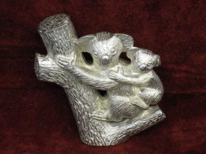 Koala with baby in tree