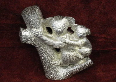 Koala with baby in tree